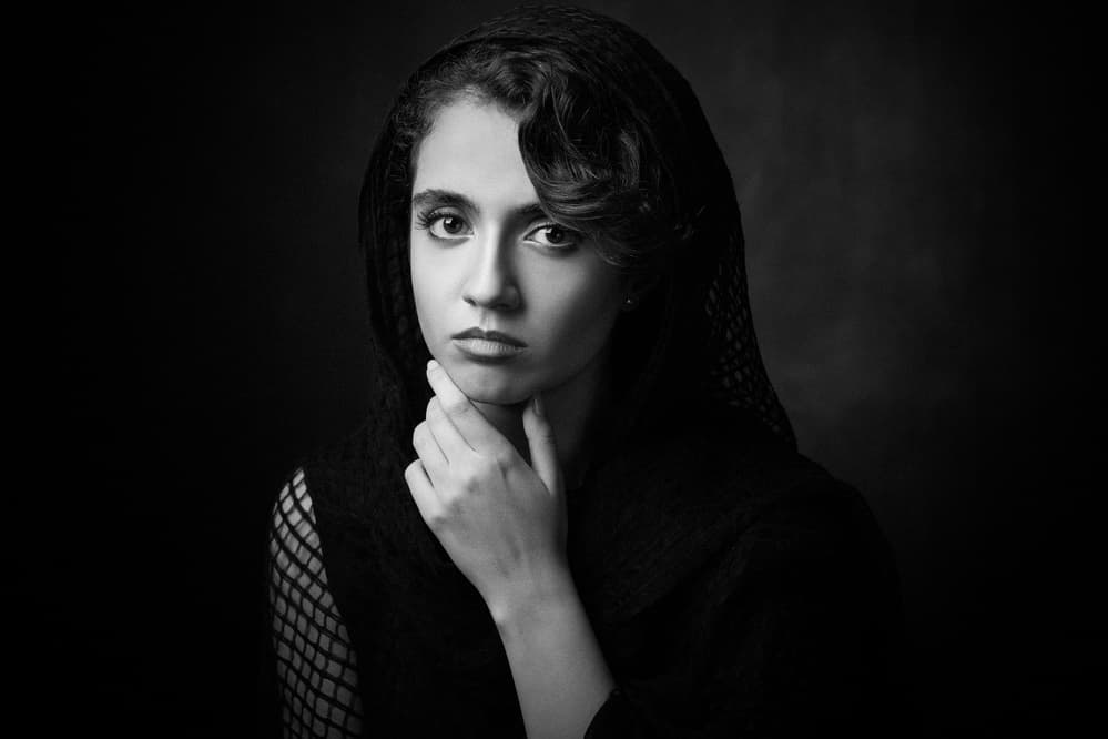 Pensive Woman in Black by Mehdi Mokhtari — canvas wall art