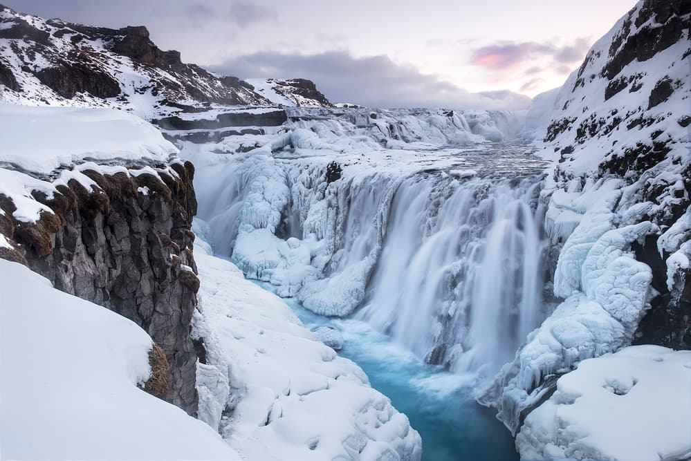 Powerful Winter Waterfall by Nicola Molteni — canvas wall art