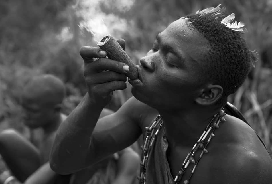 African Man Smoking Pipe by Amnon Eichelberg — canvas wall art