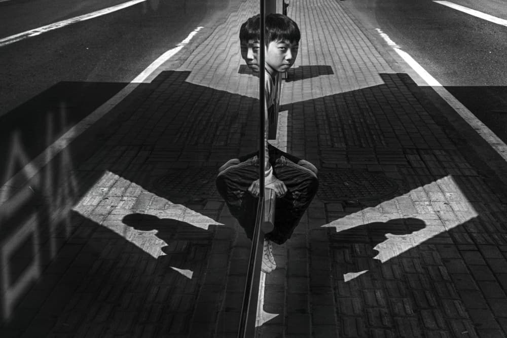 Boy in Street Reflection by YouduTian(田有杜) — canvas wall art