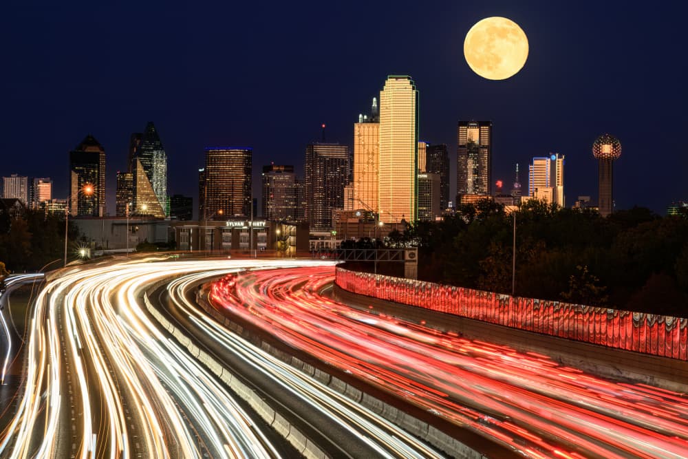 Moonlit City Light Trails by Mike He — canvas wall art