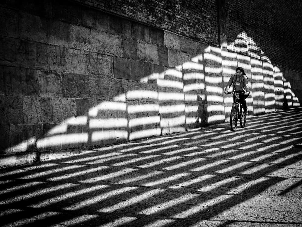 Striped Shadow Cyclist by Adolfo Urrutia — canvas wall art