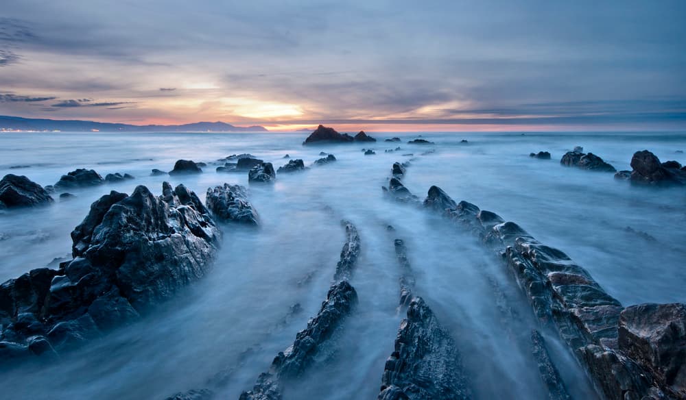 Misty Coastal Sunset by Mikel Lastra — canvas wall art