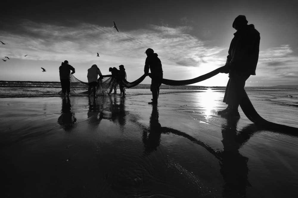 Silhouetted Fishermen At Dawn by Josefina Melo — canvas wall art