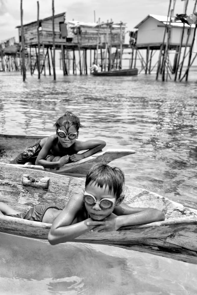 Village Children Goggles by Kieron Long — canvas wall art