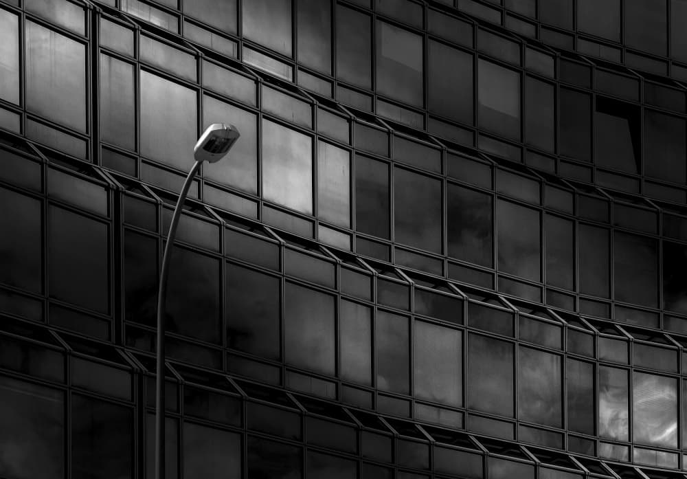 Streetlight on Glass Facade by Wim Schuurmans — canvas wall art