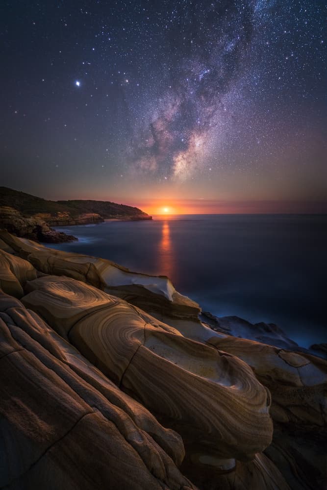 Milky Way Ocean Glow by Tim Fan — canvas wall art