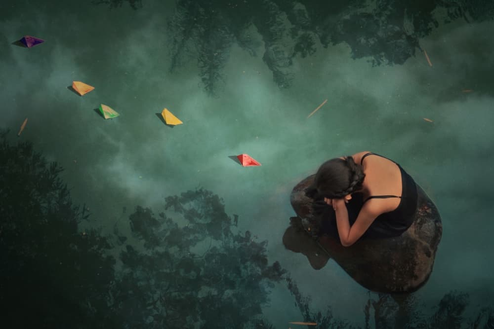 Woman Among Paper Boats by Jay Satriani — canvas wall art