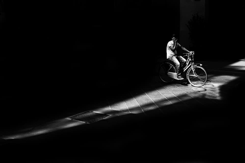 Cyclist in Dramatic Light by Enrico Finotti Re — canvas wall art