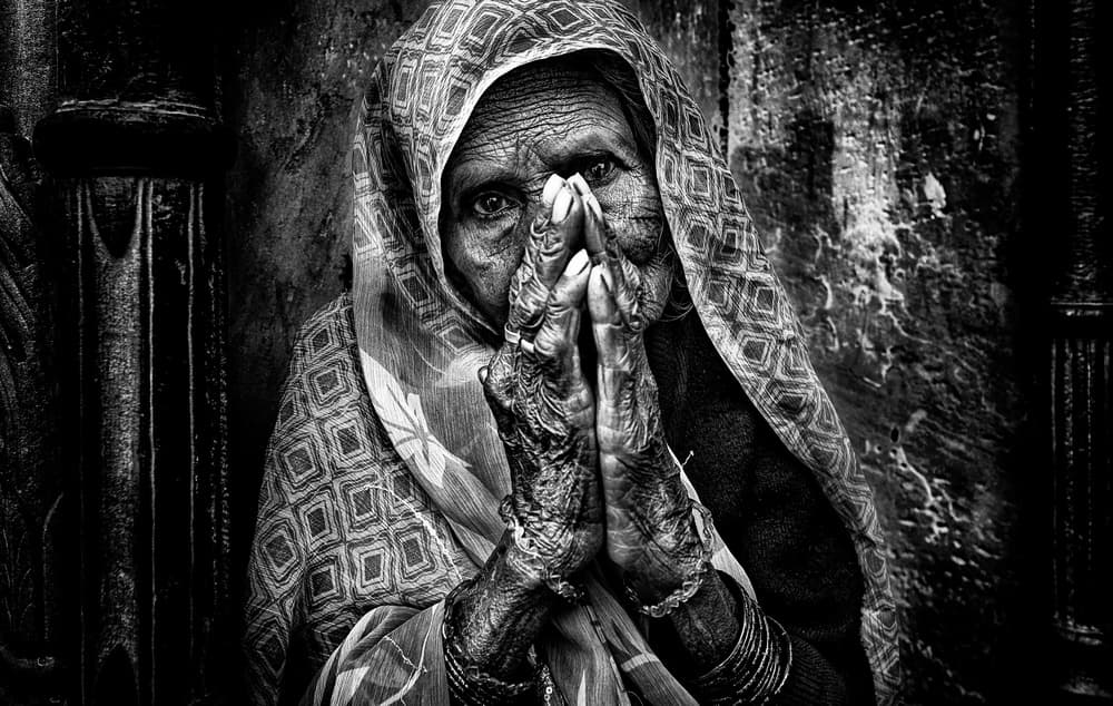 Elderly Woman Praying by Joxe Inazio Kuesta Garmendia — canvas wall art