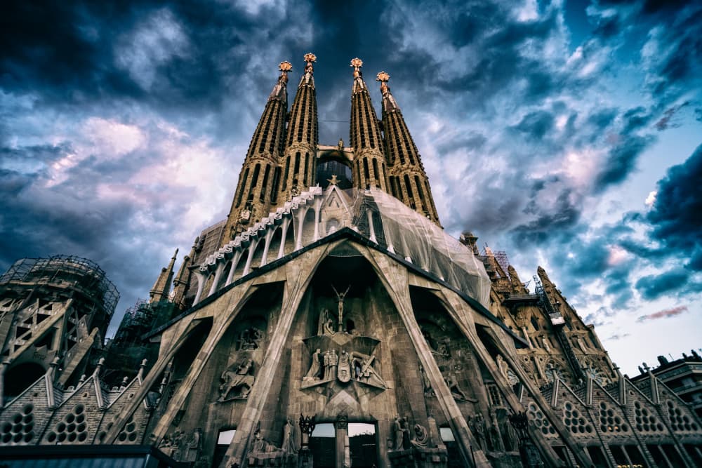 Sagrada Familia Dramatic Sky by Merthan Kortan — canvas wall art