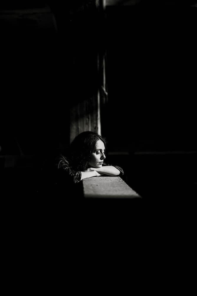 Pensive Woman In Shadow by Yuri Shepelev — canvas wall art