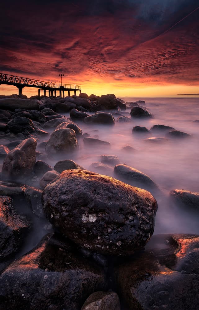 Misty Ocean Pier Sunset by Anto Camacho — canvas wall art