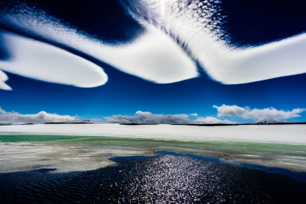 Winter Sky Over Frozen Water by Ralf Kayser — canvas wall art