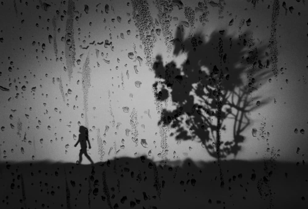 Lone Figure Rainy Window by Kahar Lagaa — canvas wall art