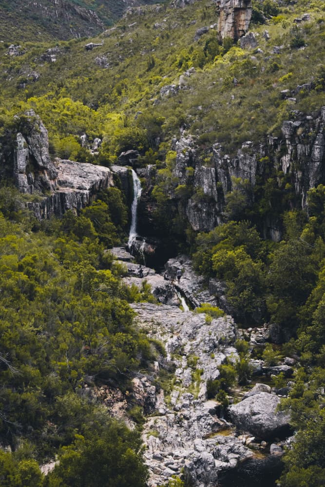Lush Valley Waterfall by Kauthar Isaacs — canvas wall art