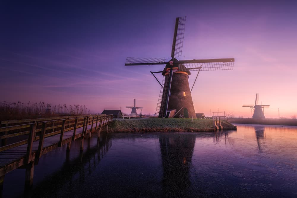 Purple Sky Windmills by Clara Gamito — canvas wall art