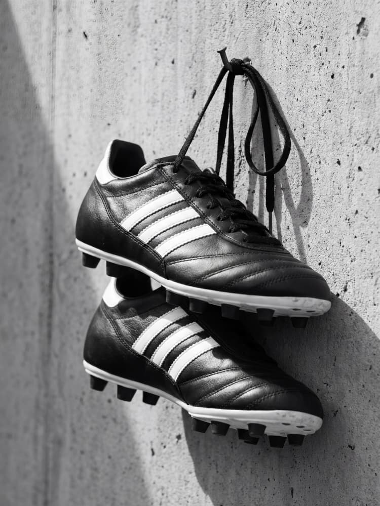 Hanging Soccer Cleats by Andreas Magnusson — canvas wall art