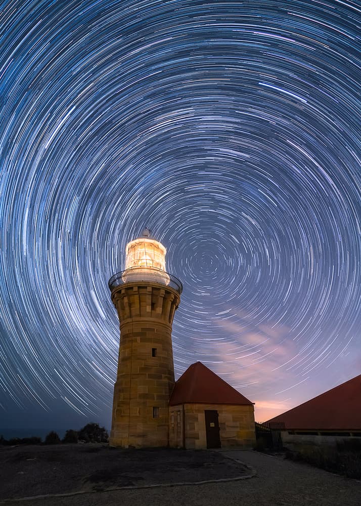 Lighthouse Star Trails Night by Jingshu Zhu — canvas wall art