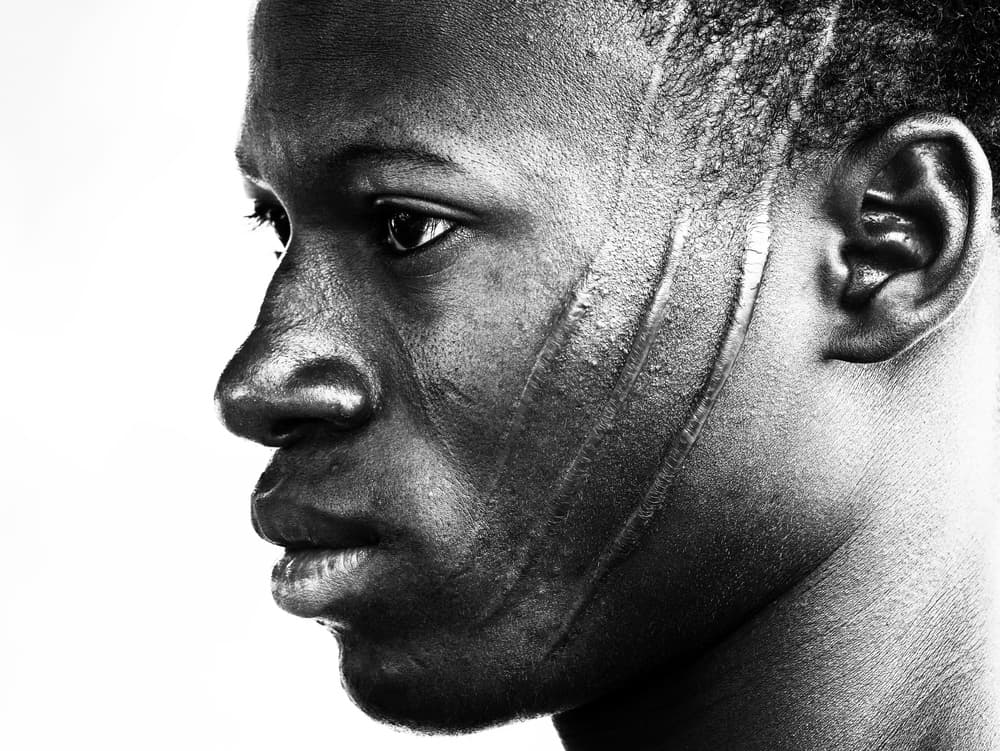 African Scarification Portrait by Elena Molina — canvas wall art