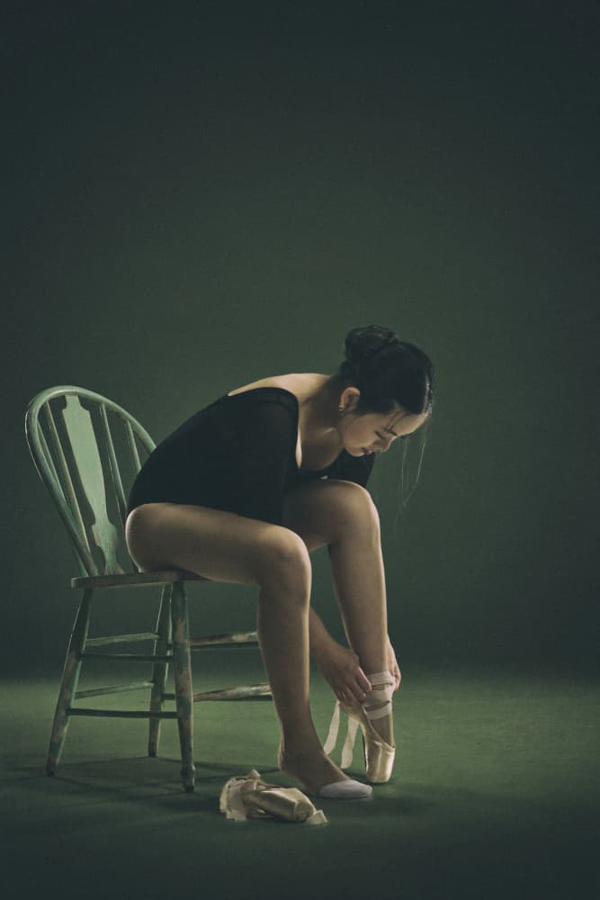 Ballerina Tying Pointe Shoes by Rob Li — canvas wall art