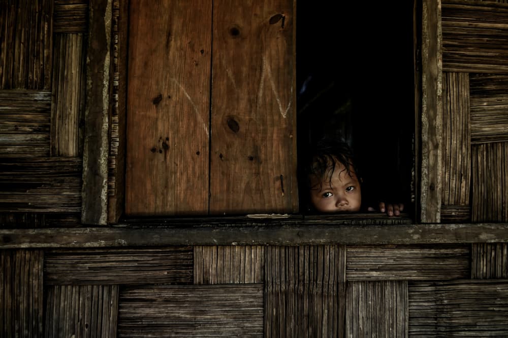 Curious Child Peeking Window by Debarshi Mukherjee — canvas wall art
