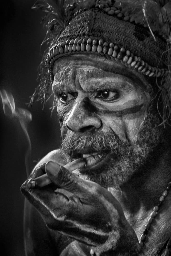 Indigenous Man Smoking by Angela Muliani Hartojo — canvas wall art