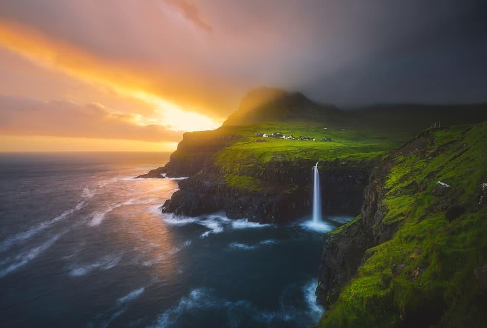 Golden Coastal Waterfall by Cuma Cevik — canvas wall art