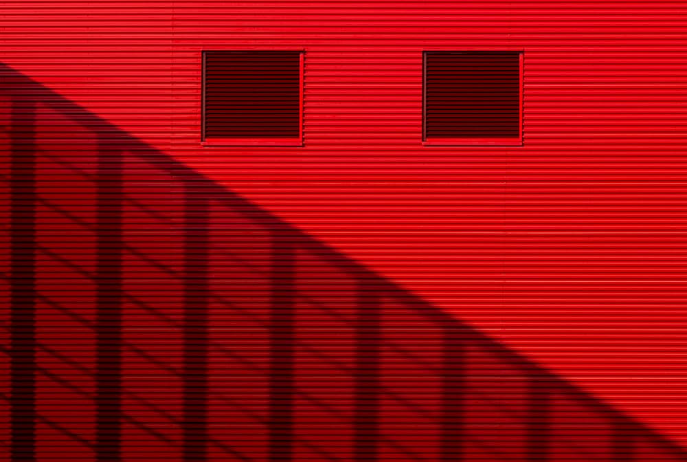 Red Wall Shadows by Jan Niezen — canvas wall art