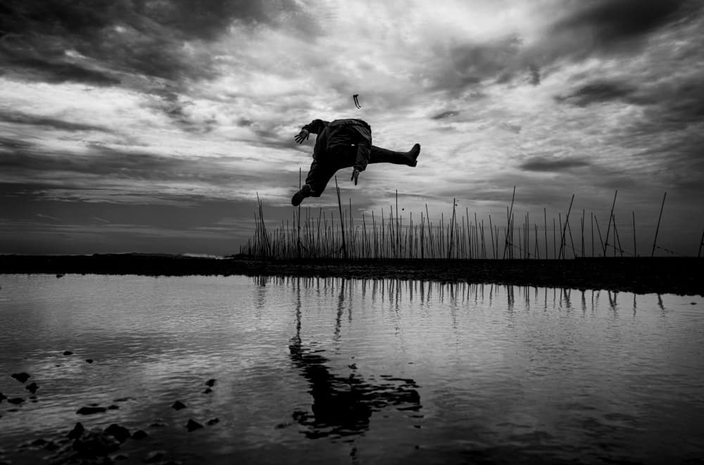 Floating Man Reflection by Bong Goo Kang — canvas wall art