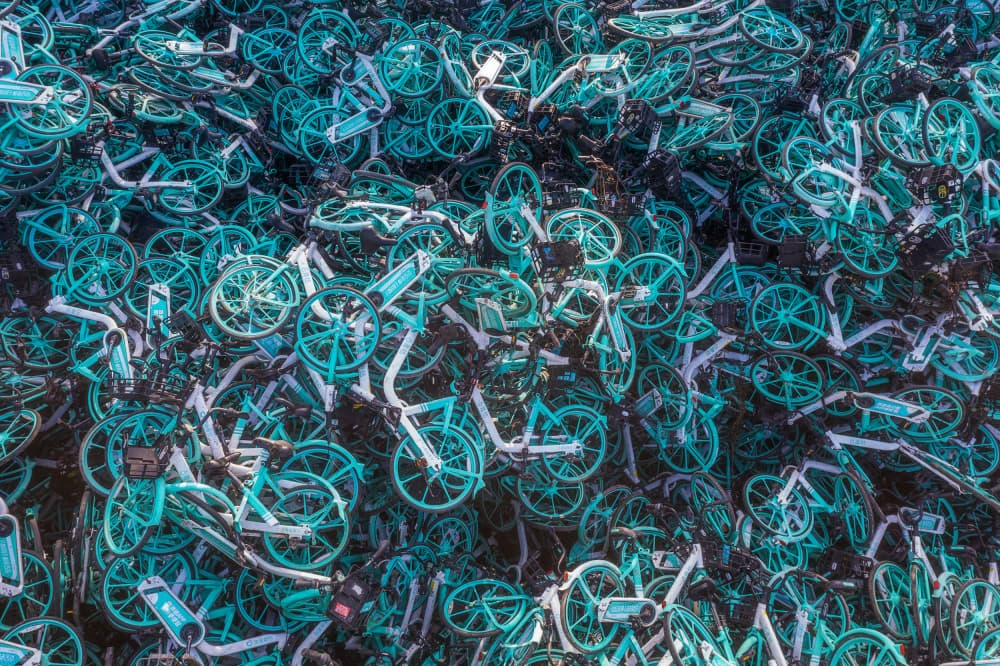 Crowded Teal Bicycles by Xiaoyang Wang — canvas wall art
