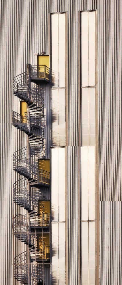 Yellow Doors Spiral Staircase by Anna Cseresnjes — canvas wall art