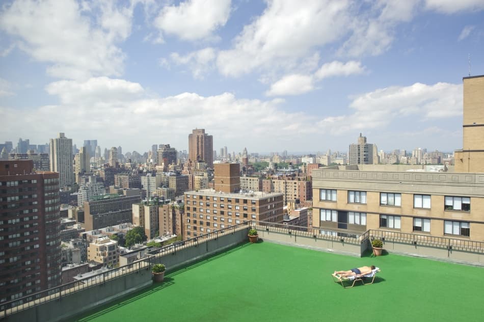 Urban Rooftop Sunbathing by Avi Revivo — canvas wall art