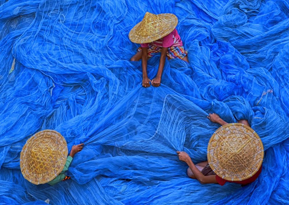 Working Blue Nets by Ajit Kumar Majhi — canvas wall art