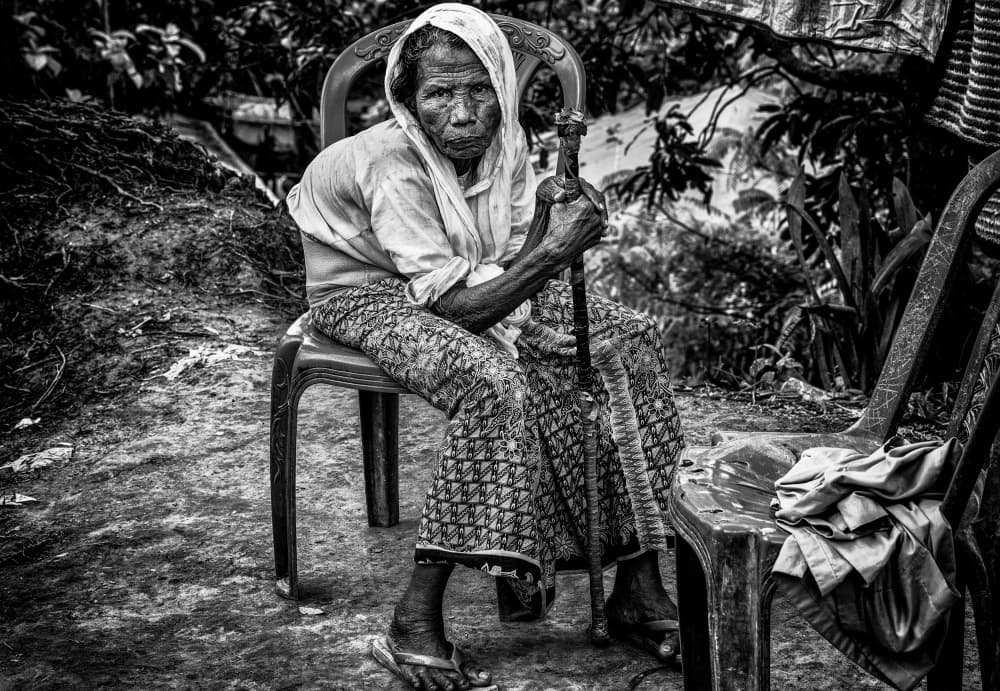 Elderly Woman With Cane by Joxe Inazio Kuesta Garmendia — canvas wall art