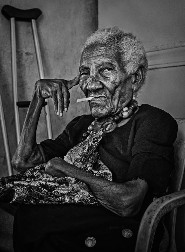 Smoking Old Woman by PAUL GOMEZ — canvas wall art