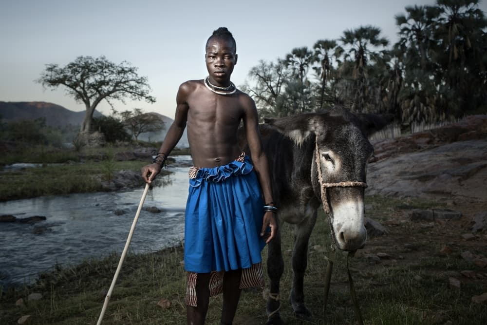 African Boy and Donkey by Ben McRae — canvas wall art