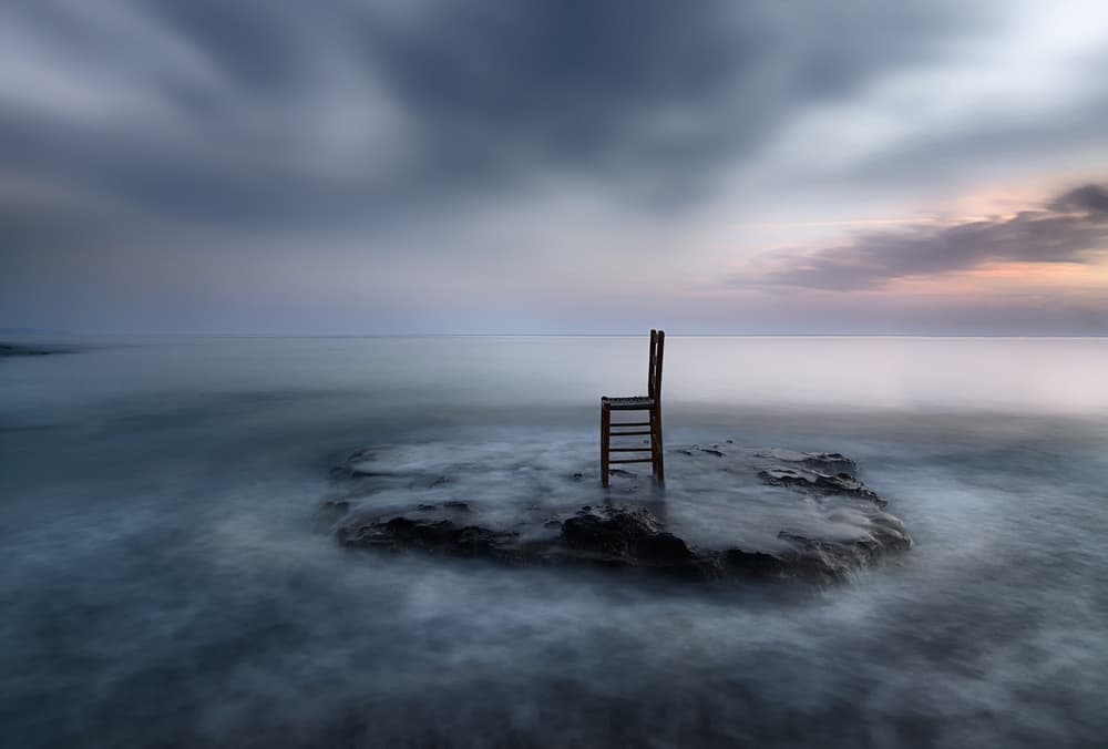 Solitary Chair By The Sea by Maria Kaimaki — canvas wall art