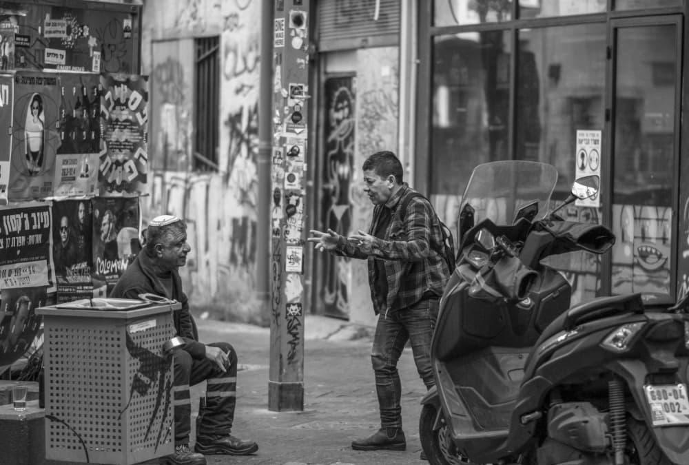 Street Conversation by Itzik Einhorn — canvas wall art