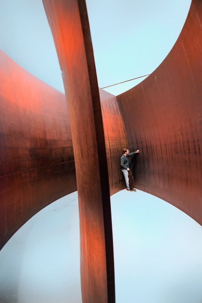 Man Explores Curved Steel by Jure Kravanja — canvas wall art