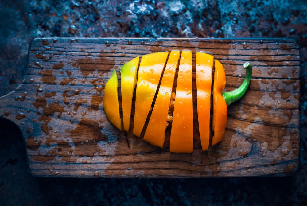 Vibrant Pepper Slices by Karina Aleksandrova — canvas wall art