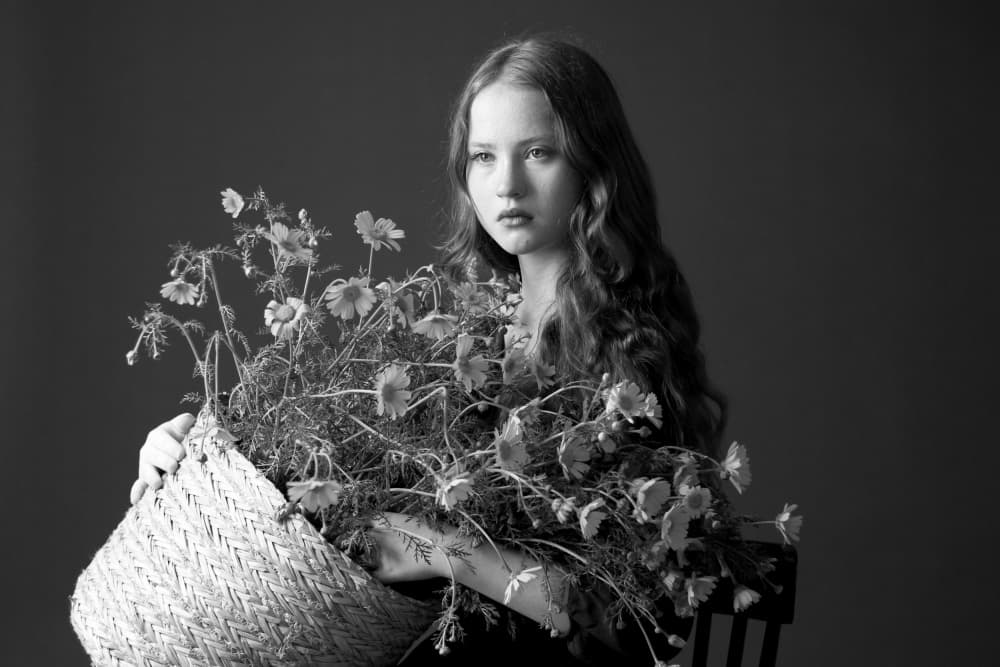 Pensive Girl with Flowers by Anna Kogan — canvas wall art