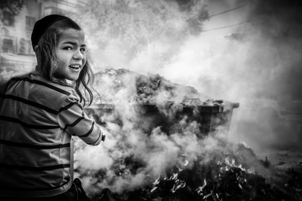 Curious Boy Burning Waste by Tomer Eliash — canvas wall art