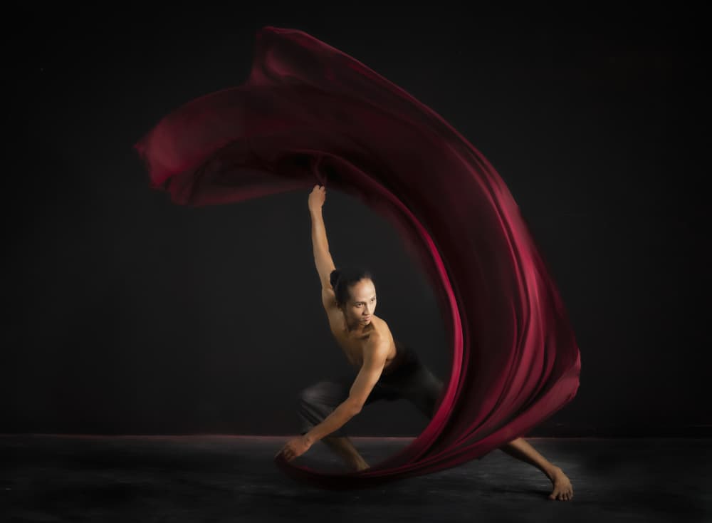 Dynamic Red Fabric Dance by Rini Widyantini — canvas wall art