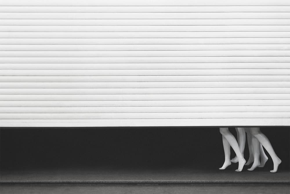 Mannequin Legs Under Shutter by Mohammad Rasool Fahmani — canvas wall art