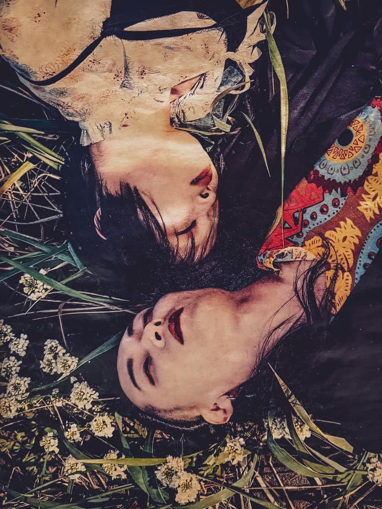 Serene Faces in Grass by Kurosaki Sangan — canvas wall art