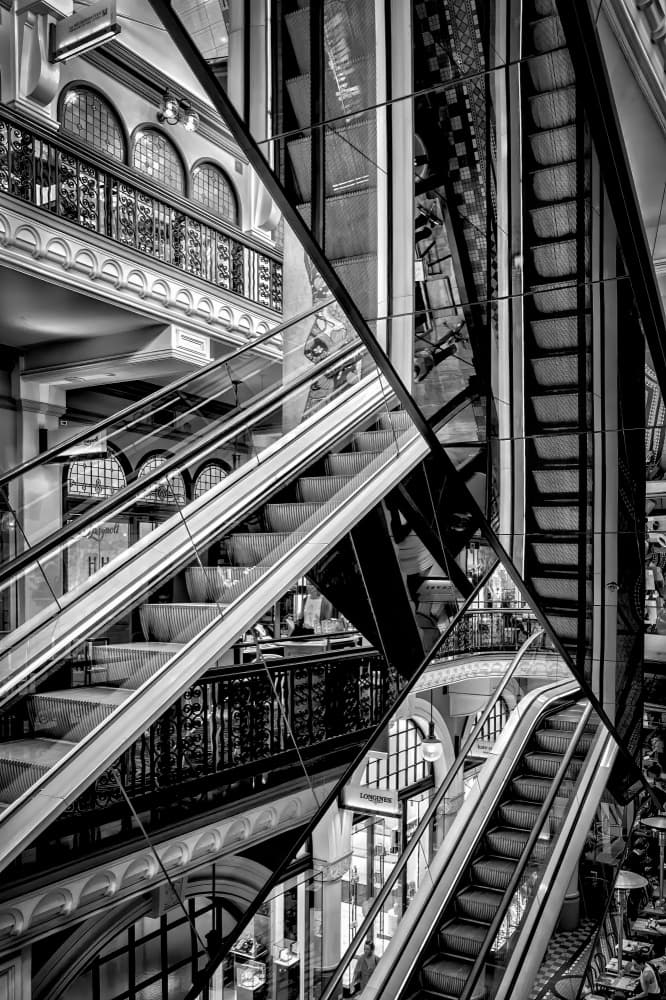 Geometric Escalator Reflections by Michel Groleau — canvas wall art