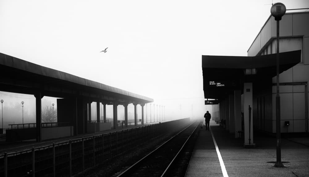 Foggy Train Station Journey by Julien Oncete — canvas wall art