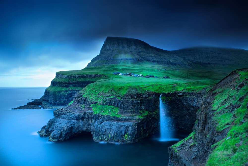 Remote Island Waterfall Village by Trevor Cole — canvas wall art