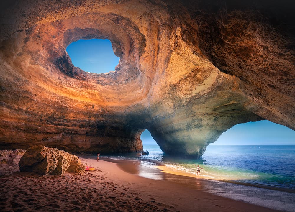 Sunlit Ocean Cave Beach by Karol Nienartowicz — canvas wall art
